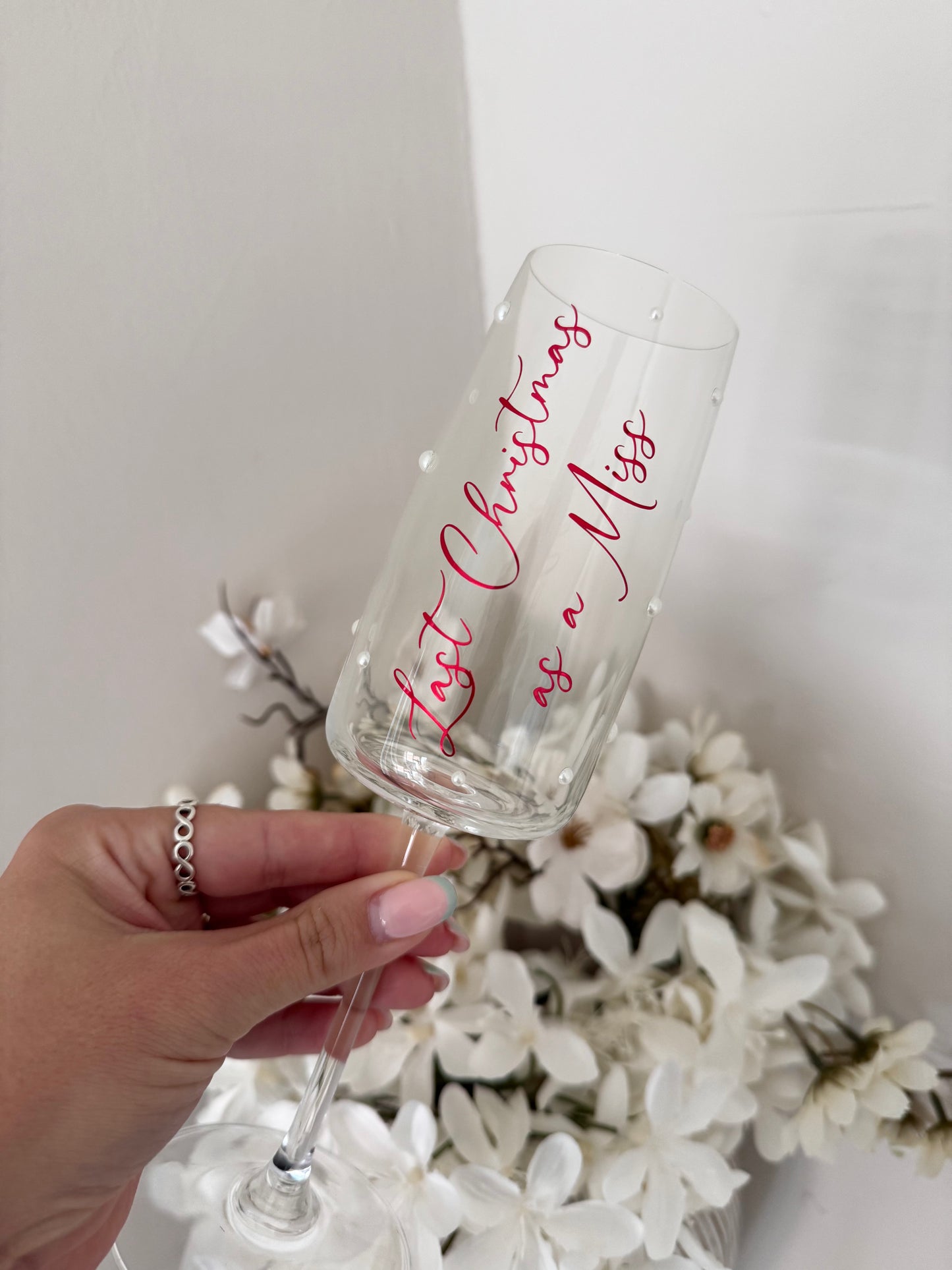 Last Christmas as a Miss champagne flute pearls